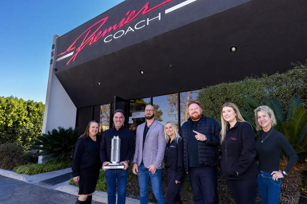  #1 BMW Certified Collision Repair Center (CCRC) Cliff Sullivan (Premier Coach Owner) Holding #1 BMW CCRC Trophy with National Manager of BMW CCRC Program Jonathan Inzano