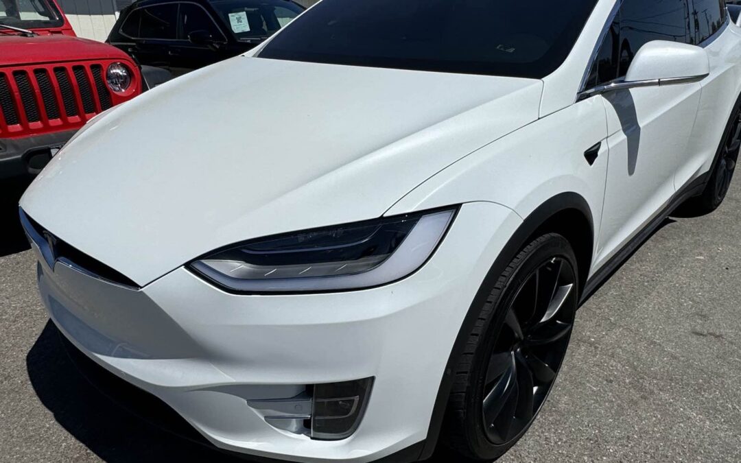 White Tesla Model X at Premier Coach Auto Collision in Thousand Oaks, California.
